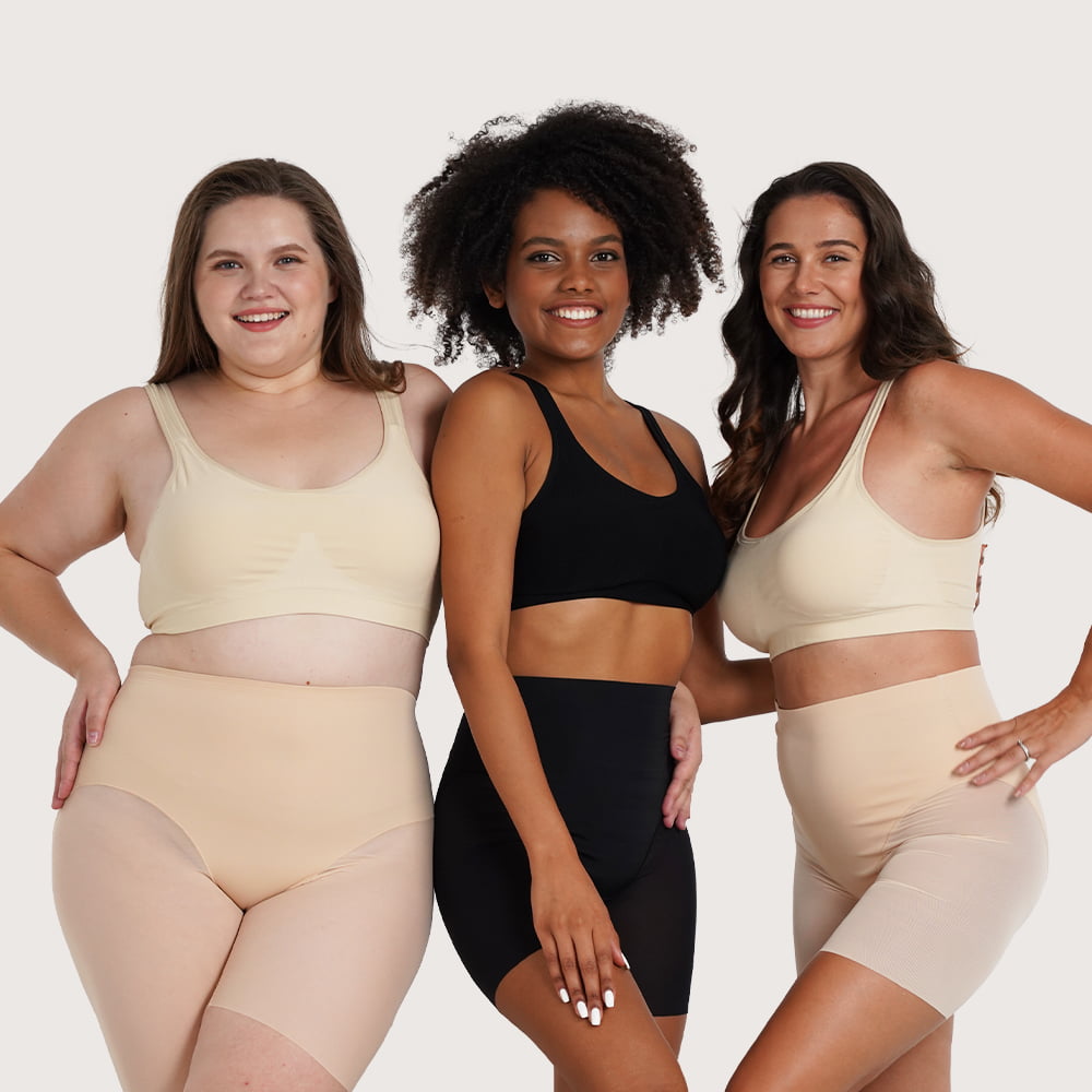 Drie vrouwen die shapewear dragen in verschillende huidtinten